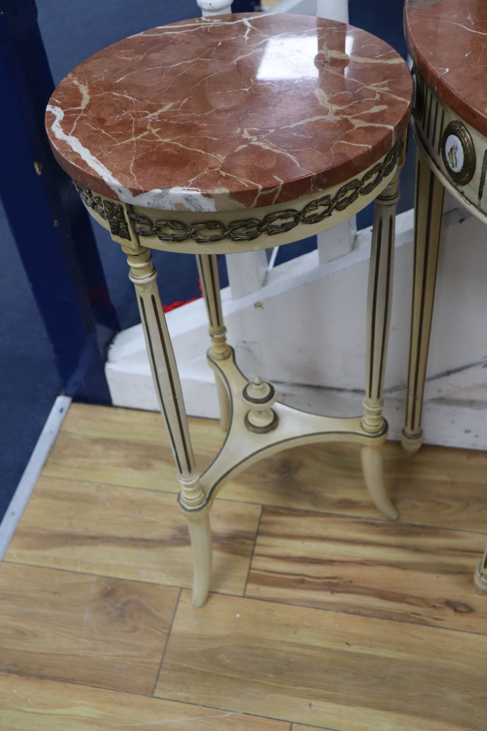 A pair of parcel gilt cream painted occasional tables with rouge marble tops and a similar demi-lune table with cracked marble top